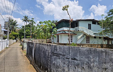 plot with house for sale in angamly
